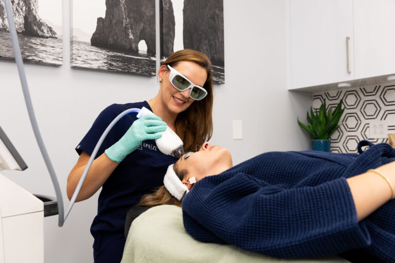 Professional using Halo laser near Marana, AZ, to fix sun damage on patient.